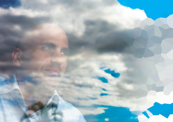 Man looking at the sky and clouds